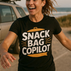 "Snack Bag Copilot" black road trip shirts, photographed as gifts for road trip lovers