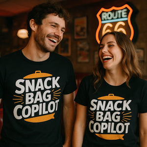 Person wearing the black road trip shirts graphic tee - "Snack Bag Copilot" design