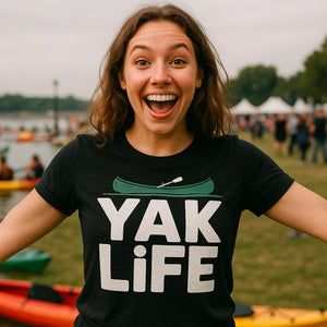 Lifestyle shot of the "Yak Life" black red canoe t shirt in a real-world setting