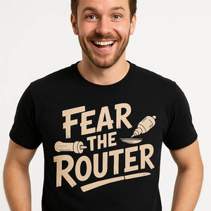 Close-up of the "Fear the Router" tan print on a premium Bella+Canvas black woodworking t shirt