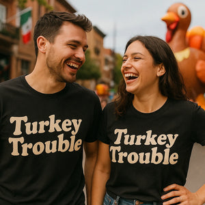 Person wearing the black thanksgiving tees graphic tee - "Turkey Trouble" design