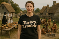 A person wearing a black t-shirt with the text 