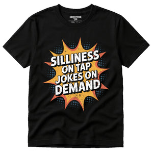 Black Comedy T Shirt - "Silliness on Tap Jokes on Demand" graphic tee with gold print, flat lay product photo