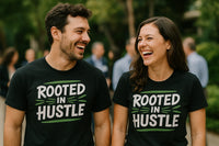 A man and a woman are standing next to each other, both wearing black shirts with the text 