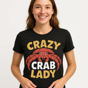 Close-up of the "Crazy Crab Lady" gold print on a premium Bella+Canvas black hermit crab t shirt