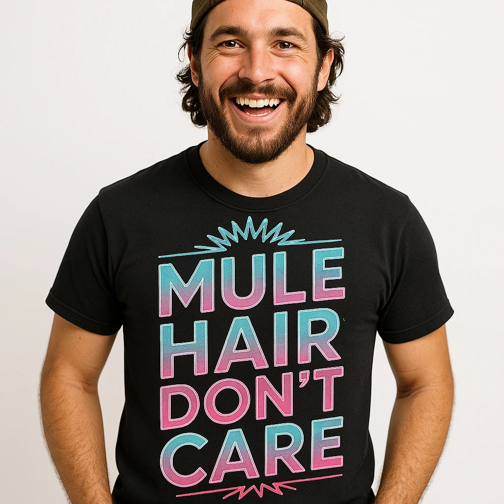 Close-up of the "Mule Hair Don'T Care" gray print on a premium Bella+Canvas black mule t shirt