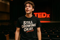 A person wearing a black t-shirt with the text 