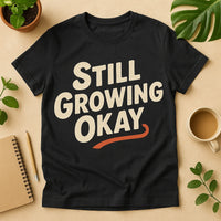 A black T-shirt with bold white text saying 