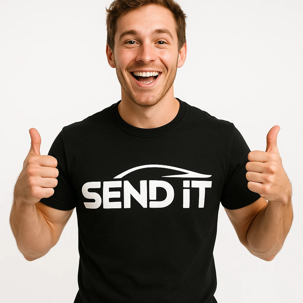 Close-up of the "Send It" white print on a premium Bella+Canvas black car t shirt