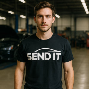 Lifestyle shot of the "Send It" black car t shirt in a real-world setting