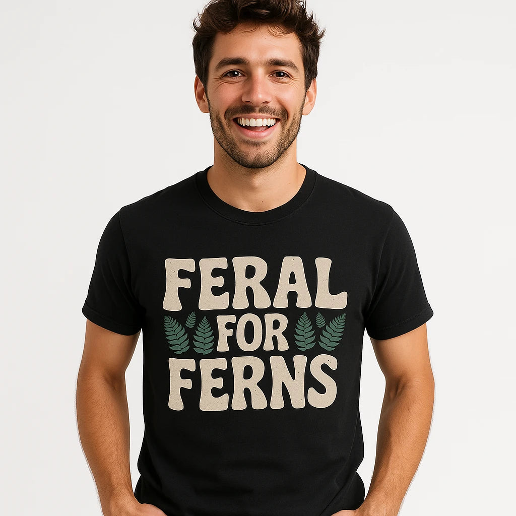 Close-up of the "Feral for Ferns" light gray print on a premium Bella+Canvas black nature walk t shirt