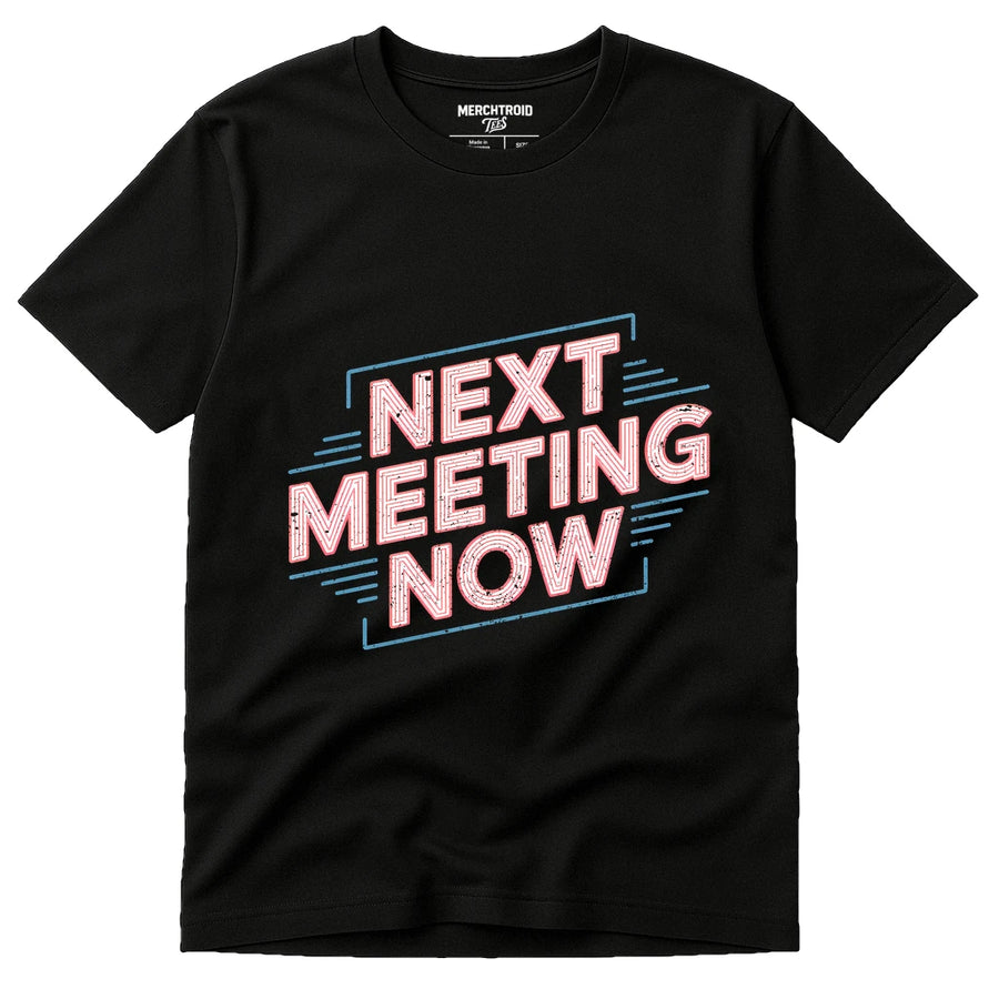 A black t-shirt with bold, stylized text reading "NEXT MEETING NOW" in red and outlined in blue, featuring decorative lines. The shirt label reads "MERCHTROID."