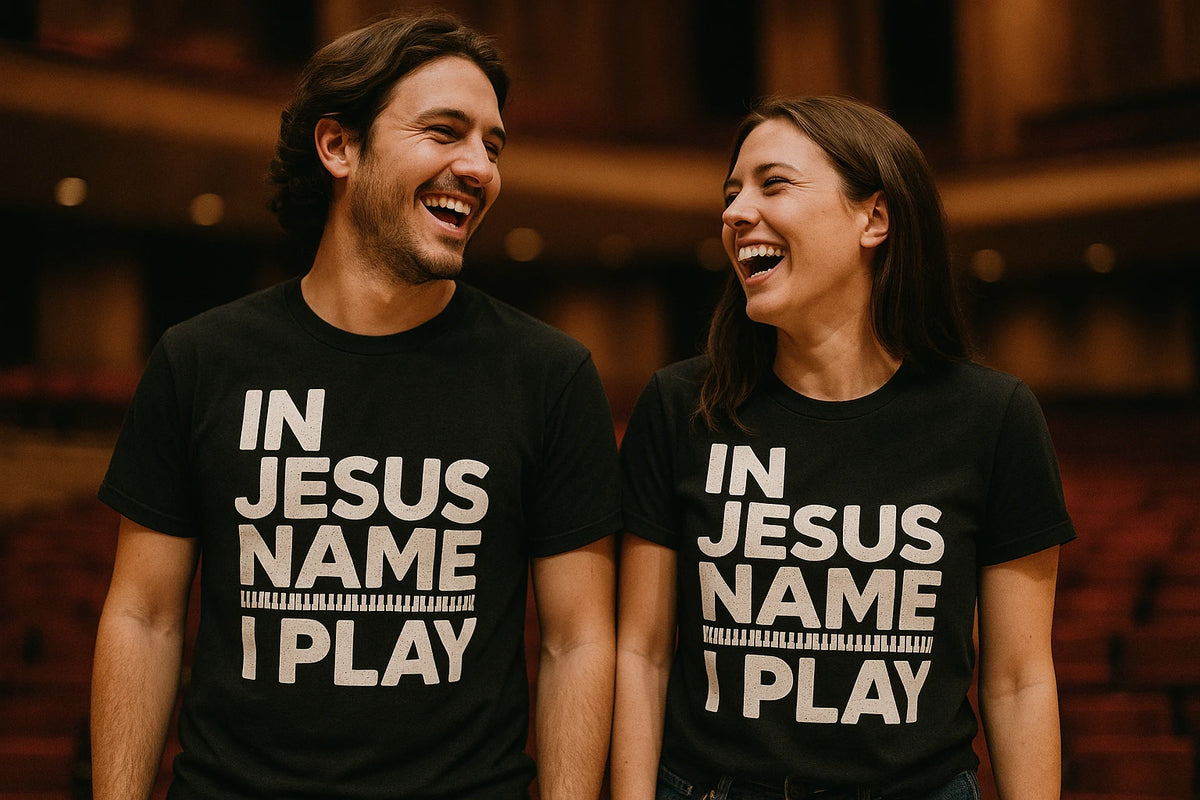 Person wearing the black piano shirts graphic tee - "In Jesus Name I Play" design