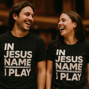 Person wearing the black piano shirts graphic tee - "In Jesus Name I Play" design