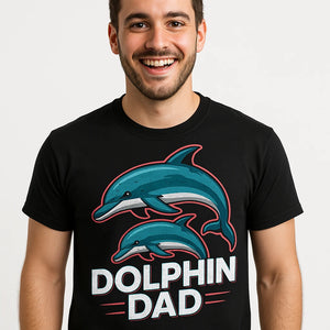 Close-up of the "Dolphin Dad" teal print on a premium Bella+Canvas black dolphin tee