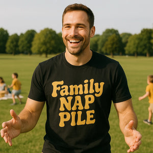 Lifestyle shot of the "Family Nap Pile" black family life t shirt in a real-world setting