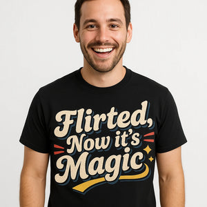 Close-up of the "Flirted, Now It’S Magic" cream print on a premium Bella+Canvas black relationships shirts