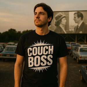 Lifestyle shot of the "Couch Boss" black graphic tee in a real-world setting