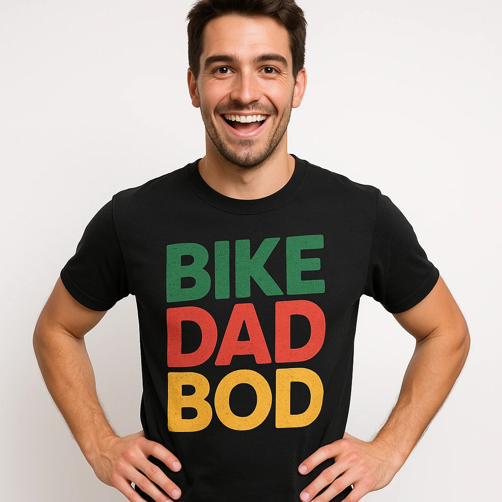 Close-up of the "Bike Dad Bod" orange print on a premium Bella+Canvas black custom cycling shirts