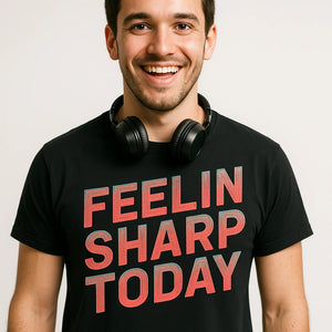 Close-up of the "Feelin Sharp Today" orange print on a premium Bella+Canvas black funny classical music t shirts